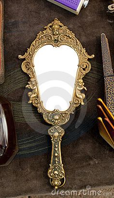 there is a mirror and other items on the table