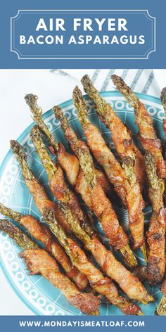 bacon wrapped asparagus on a plate with text overlay reading air fryer bacon asparagus