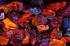 colorful rocks are lit up in the dark