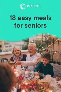 an older couple and two young children sitting at a table with food in front of them