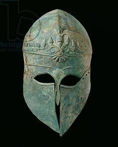 an ancient roman helmet on a black background