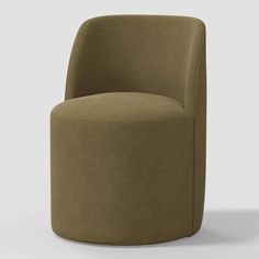 an upholstered chair with a rounded seat and backrest, in brown fabric