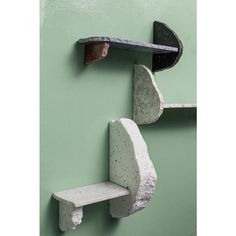 two concrete shelves are attached to the wall