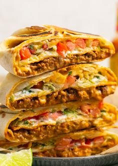 three tacos stacked on top of each other