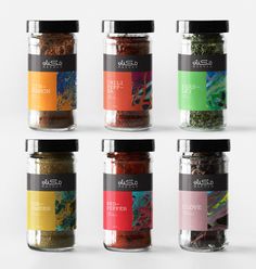 six jars filled with different colored spices