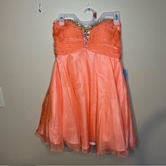 Short Strapless Lace Up Homecoming Dress By Alyce Paris. Pink/Coral Color. Brand New With Tags. Size 8. Smoke And Pet Free Home Orange Mini Dress, Paris Pink, Alyce Paris, Paris Dresses, Pink Coral, Homecoming Dress, Coral Color, Orange Pink, Homecoming Dresses