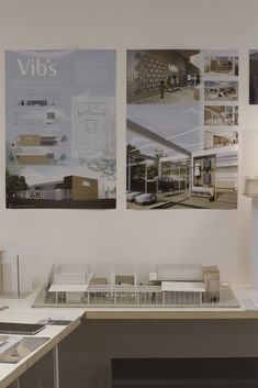 a desk with several architectural models on it