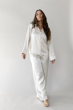 Our Silk Pajama Pant is here. Made from 100% mulberry silk fabric treated with aloe vera for a soothing touch. Perfect for lounging and sleeping, this lightweight, ultra-luxe sleep pant is designed for comfort with a relaxed wide-leg fit and adjustable elastic waistband. Luxury details include mulberry silk piping, inner French seams, and an eco-friendly plated logo charm. Pair it with our silk short-sleeve or long-sleeve pajama top for the ultimate silk sleep set. Women's Serenity Silk Classic Classy Loungewear, Silk Pajama Pants, Nightwear Dress, Silk Comforter, Luxury Details, Mulberry Silk Fabric, White Pajamas, Classic Pajamas, Silk Pajama