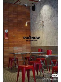 the interior of a restaurant with red chairs and tables