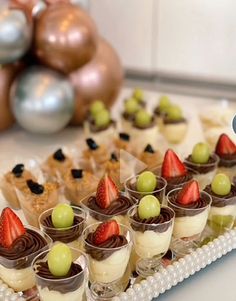 small desserts are arranged on a tray