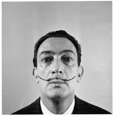 a man with a fake mustache on his face is shown in this black and white photo