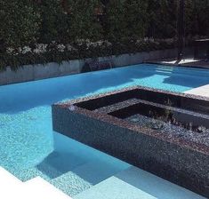 an empty swimming pool with steps leading up to it