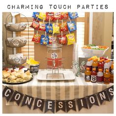 a table topped with snacks and condiments next to a sign that reads, charming touch parties