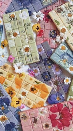 many different colored tiles with flowers on them