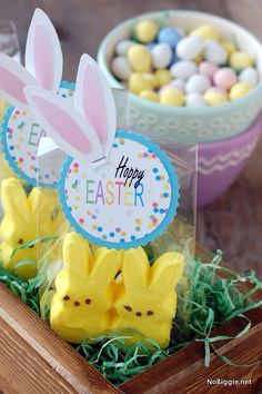 some peep - poop easter treats are in a wooden box on the table