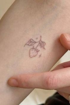 a person with a small tattoo on their arm