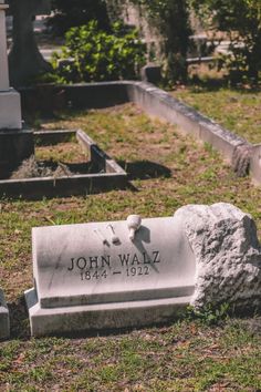 the headstone of john walz is shown in front of an old cemetery grave