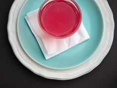 a blue plate topped with a pink liquid