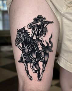 a man with a cowboy hat on his head riding a horse