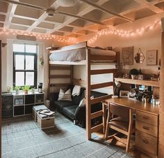 a bedroom with bunk beds and desk in it