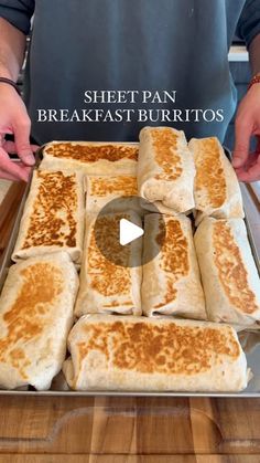 a pan filled with lots of food on top of a wooden table