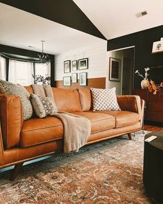 a living room filled with furniture and decor