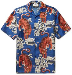 <a href='http://www.mrporter.com/mens/Designers/Gucci'>Gucci</a>'s shirt is printed with roaring Bengal tigers and Japanese pine trees – a key print from the brand's latest collection, it references Creative Director Mr Alessandro Michele's love of nature. In a vivid royal-blue, green and saffron palette, it's been made in Italy from glossy silk-twill. The regular cut and camp collar enhance its easy-going feel. Try yours ... Gucci Menswear, African Tops, Mens Printed Shirts, Gucci Gucci, Twill Shirt, Bowling Shirts, Men's Shirts, Slim Jeans, Silk Shirt