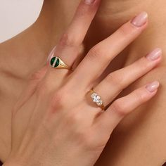 Radiate sophistication with our Green Enamel Line Pave Signet Ring. The surface of the ring finished with green and decorated with sparkling line, creating a modern yet timeless aesthetic. This versatile piece effortlessly elevates any style, making it a must-have for those who seek a touch of sophisticaiton and a pop of color in their accessories. - Made in 14k solid gold - Decorated with handset white cubic zirconia stone - Finished with Green Enamel - Band Width: 1.55 mm / 0.06 inches -Top Wi Modern Green Signet Ring With Polished Finish, Timeless Green Diamond Promise Ring, Luxury Green Signet Ring With Polished Finish, Timeless Green Signet Ring With Polished Finish, Classic Green Open Signet Ring, Timeless Green Diamond Ring Gift, Modern Emerald-cut Green Diamond Ring, Modern Green Signet Ring For Anniversary, Luxury Green Rings With Bezel Setting