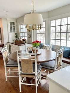 a dining room table and chairs in a kitchen