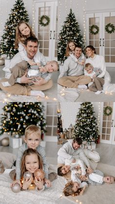 a family sitting on the floor in front of christmas trees