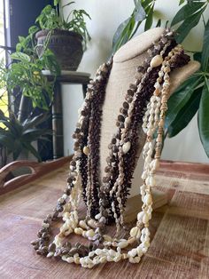 the necklaces are made from shells and beads