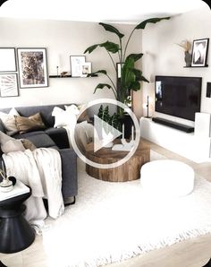 a living room filled with furniture and a flat screen tv on top of a wooden table