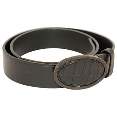 FENDI Black Leather Crocodile Cowboy Belt. Oval shape belt buckle in antiqued brass with crocodile leather inset . Dress up or dress down, this belt can be worn for any occasion. The oval shape buckle is 3.5" wide x 2.75". Fendi black leather waist belt. Leather is marked Fendi, size 32 US/ 95 EU. Brass buckle is marked FENDI Made in Italy. FENDI is an Italian luxury fashion house that was founded in Rome in 1925. The brand initially started as a fur and leather goods shop, but it has since expanded to include ready-to-wear clothing, shoes, accessories, eyewear, fragrances, and home furnishings. FENDI is known for its high-quality craftsmanship, innovative designs, and distinctive logo featuring the double "F" emblem. The brand gained international recognition in the 1960s when Karl Lagerf Fendi Aesthetic, Leather Waist Belt, Cowboy Belt, Belt Leather, Chanel Vintage, Crocodile Leather, Cow Boy, Brass Buckle, Italian Luxury