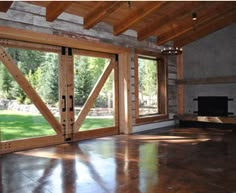 an empty living room with sliding glass doors