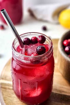 cranberry juice in a mason jar with a straw