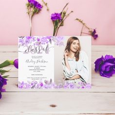 purple flowers are next to a card with the word class on it, and an image of a woman