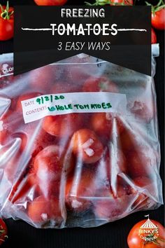 tomatoes are wrapped in plastic and ready to be packaged into the freezer with text overlay reading freezing tomatoes 3 easy ways