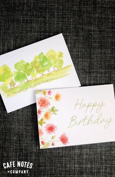 two cards with flowers on them and the words happy birthday written in gold ink next to each other