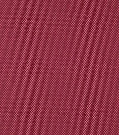 a close up view of a red fabric textured with small dots and lines on it