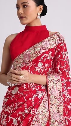 Celebrate your love for traditions and new-age designs by donning this captivating georgette saree.
Detailed with exquisite parsi gara embroidery, the jaal pattern motifs add to beauty of the silhouette.
Crafted in a vibrant red hue, the detailed multi-colored resham thread embroidery enhance your picture-perfect festive look. New Age, Vibrant Red