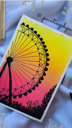 a card with an image of a ferris wheel in the background and text that reads, paintting by ya