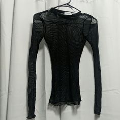 Black Long Sleeve See Through Shirt. Never Worn Black Sheer Long Sleeve Shirt, Fitted Black Sheer Shirt, Fitted Sheer Long Sleeve Shirt, Fitted Sheer Black Shirt, Sheer Tops For Winter Layering, Chic Black Sheer Shirt, Sheer Long Sleeve Shirt For Fall, Black Sheer Shirt For Night Out, Sheer Crew Neck Tops For Fall