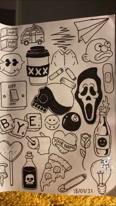 a piece of paper that has various stickers on it, including skulls and other things