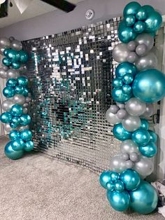 blue and silver balloons in front of a mirror