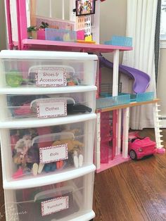 the toy storage bins are filled with toys