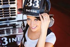 a woman wearing a fireman's hat with the number 33 on it