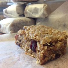 an oatmeal bar sitting on top of a piece of parchment paper