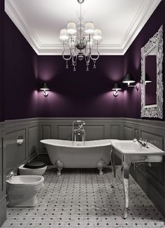 a bathroom with purple walls and white fixtures