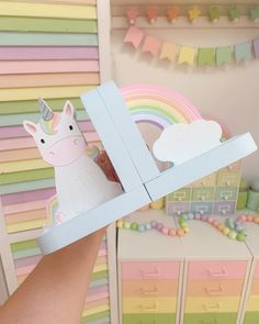 Beautiful new addition to our unicorn range, these bookends are chunky and ever so pretty. Perfectly pastel of course, with a soft duck egg blue base to the rainbow/unicorn option, and bubblegum pink for the unicorn duo. The cloud on the rainbow bookends is glittered with iridescent glitter adding that extra bit of magic.  These are as pretty as they look, and are a stunning addition to any shelf. Perfect for bedrooms, nurseries and playrooms- these will look darling anywhere. Each bookend measu Unicorn And Rainbow Bedroom Ideas, Unicorn Bookshelf, Rainbow And Unicorn Bedroom, Rainbow Bookends, Pastel Rainbow Room, Unicorn Furniture, Pastel Kids Room, Soft Pfp, Rainbows And Unicorns