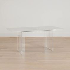 a white table sitting on top of a hard wood floor